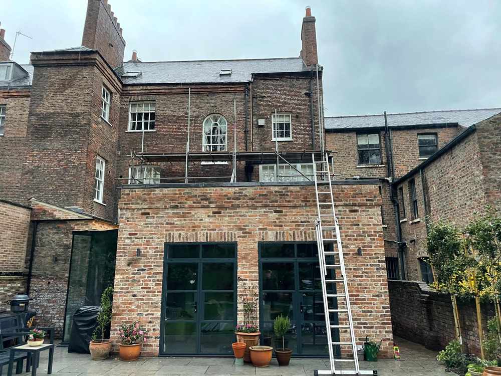 Completed home extension with steel glazed doors in York city centre by RW Builders